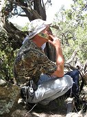 Glorieta Expeditions - Jim on the mountain ordering a pizza.