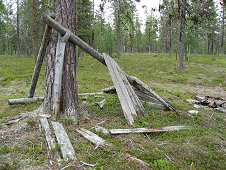 Muonionalusta Expedition - Old wooden structure in the woods.