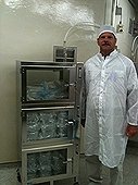 NASA - JSC Visit - Greg next to cabinet containing ALH84001 Martian samples.