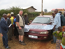 Thika, Kenya Expedition - Mike showing our driver and guide where to instruct locals to hunt for meteorites.