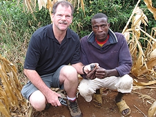 Thika, Kenya Expedition - Greg with a local who happened upon a beautiful meteorite while working.