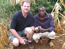 Thika, Kenya Expedition - Greg with a local who happened upon a beautiful meteorite while working.