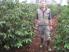 Thika, Kenya Expedition - Greg searches the rows between coffee trees.