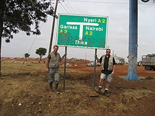 Thika, Kenya Expedition - Greg Hupe and Mike Farmer with Thika sign.