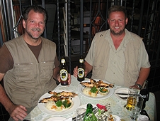 Thika, Kenya Expedition - Greg and Mike enjoying a feast of huge prawns and other local goodies.