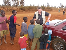 Thika, Kenya Expedition - Mike handing out more treats to the kids.