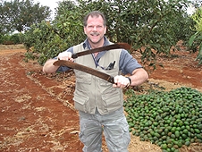 Thika, Kenya Expedition - Greg the mighty sword fighter in an avacado orchard.