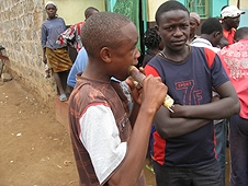 Thika, Kenya Expedition - Local boy chewing on sugar cane, daily treat.