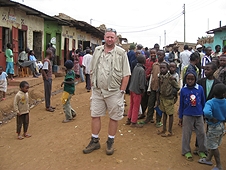 Thika, Kenya Expedition - Mike surrounded by kids in a village.