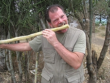 Thika, Kenya Expedition - Greg crunching on sugar cane. Lucky I didn't tear my teeth out!