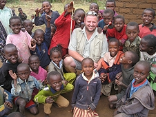 Thika, Kenya Expedition - Mike surrounded by happy Kenya kids.