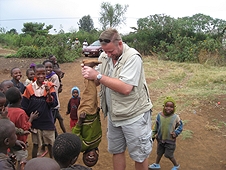 Thika, Kenya Expedition - The kids loved being swung upside down by Mike.