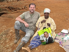 Thika, Kenya Expedition - Greg with vendor at the falls.