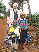Thika, Kenya Expedition - Mike with kids who received lunch boxes.